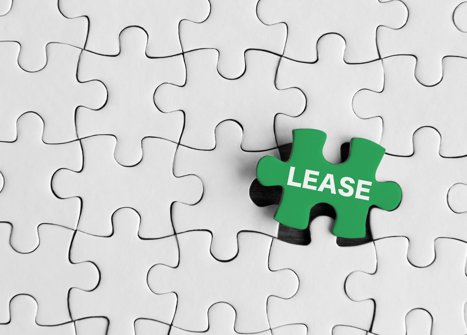 Puzzleteile mit dem Wort „Lease“.