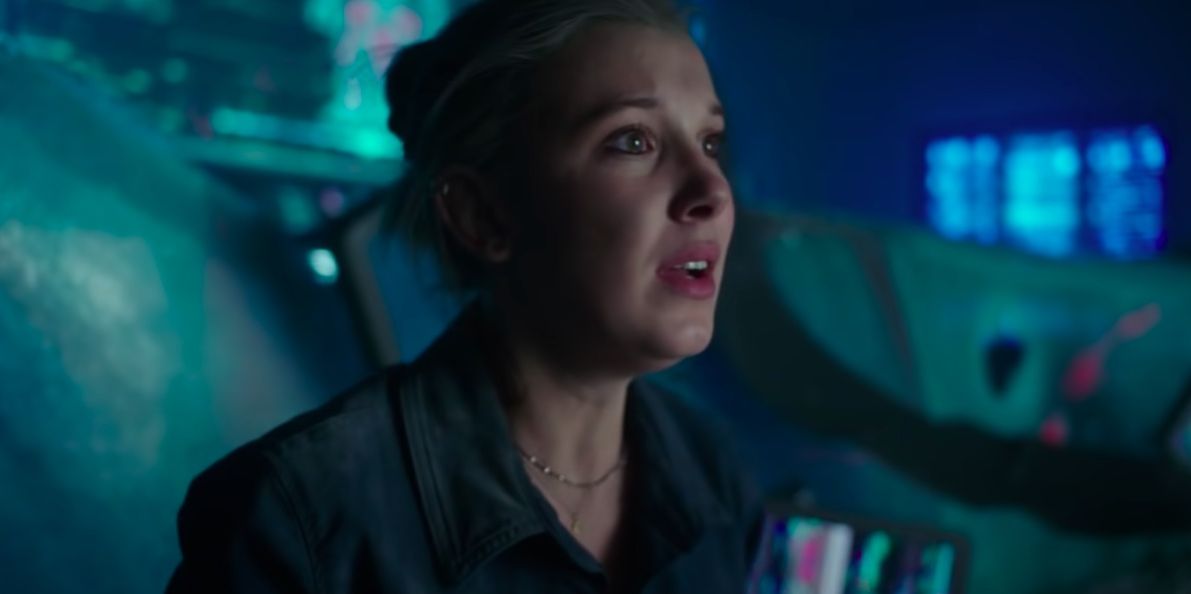 Millie Bobbie Brown in Godzilla.  Dieses Bild ist Teil eines Artikels darüber, wie das MonsterVerse das tut, was das Snyderverse nicht konnte.