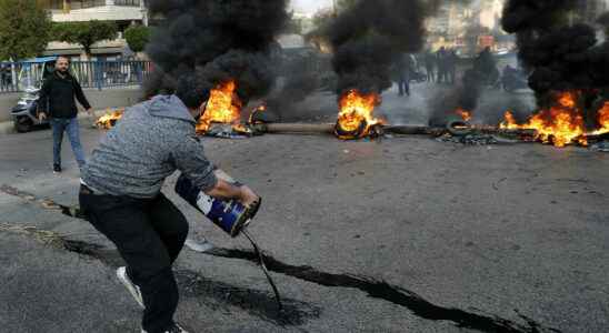 demonstrators block roads in a country simply at the end