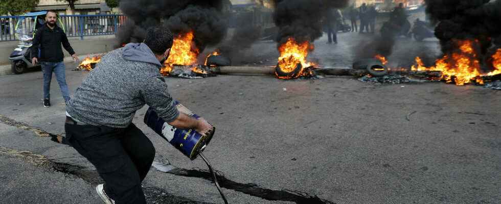 demonstrators block roads in a country simply at the end