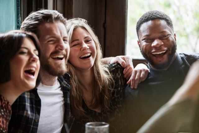 A group of friends laughing and having fun.