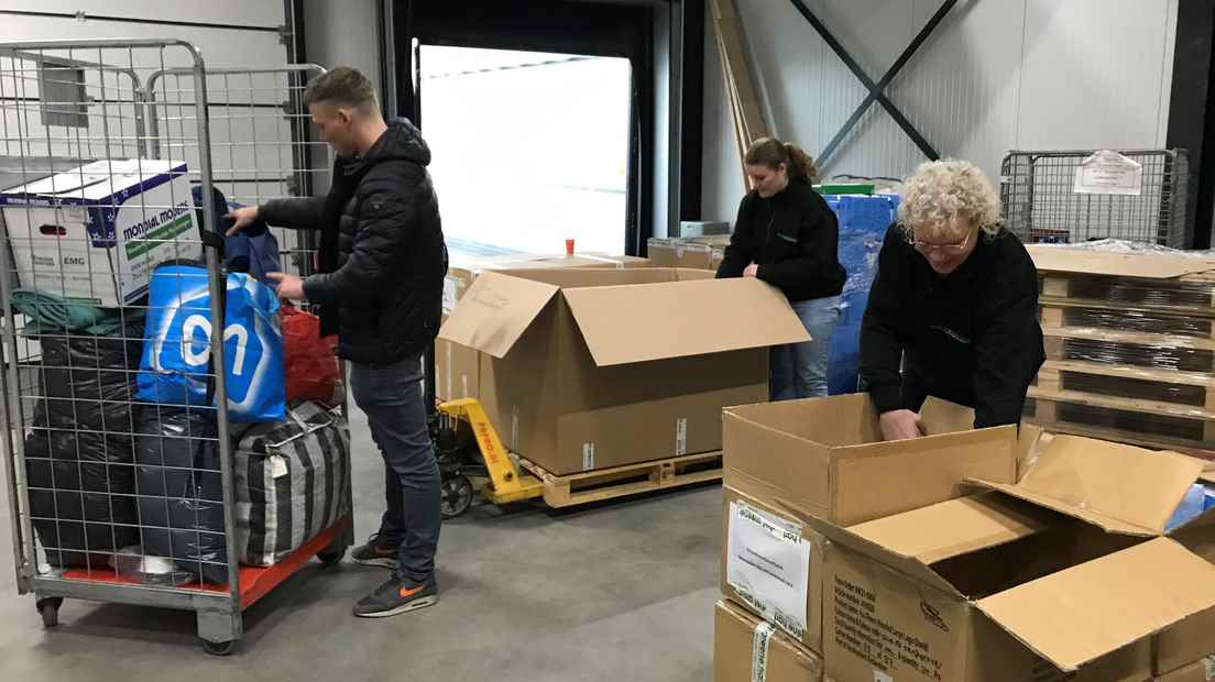 A truck is being loaded in Woerden.