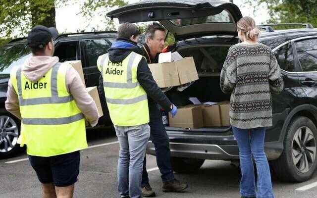 David Cameron sat in the drivers seat set off to