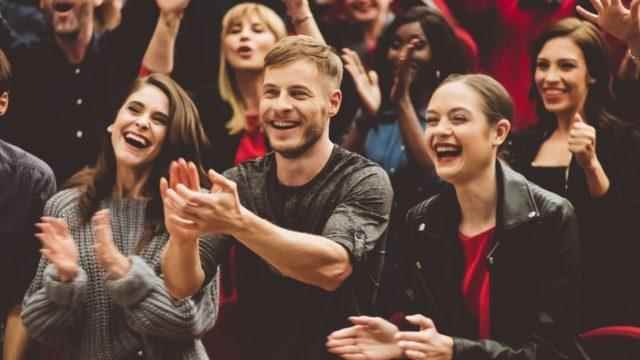 People laughing in the theater