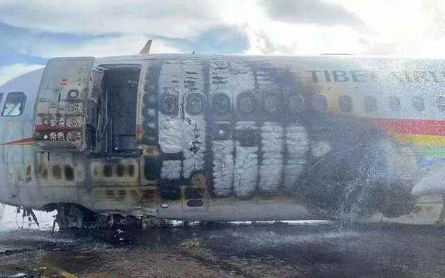 There were 122 people in it Plane caught fire during