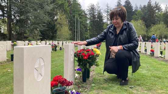 Volunteers lay flowers on the Soviet War Cemetery in Leusden