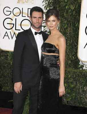 Behati Prinsloo Adam Levines wife reveals her baby bump