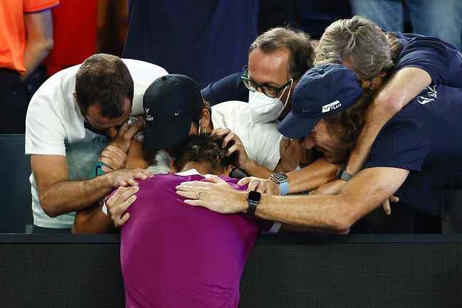 MELBOURNE, AUSTRALIA - JANUARY 30: Rafael Nadal of Spain celebrates match point with his coach Carlos Moya after winning his Menâ€™s Singles Final match against Daniil Medvedev of Russia during day 14 of the 2022 Australian Open at Melbourne Park on January 30, 2022 in Melbourne, Australia.  (Photo by Daniel Pockett/Getty Images)