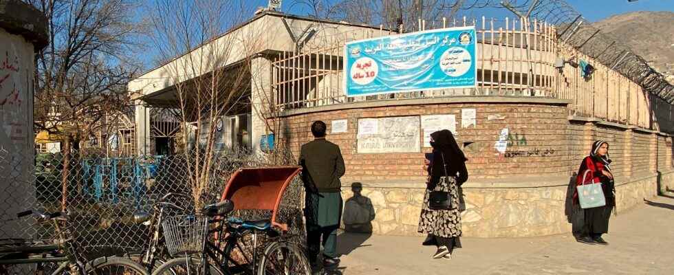 Women are stopped by guards at a university in Kabul