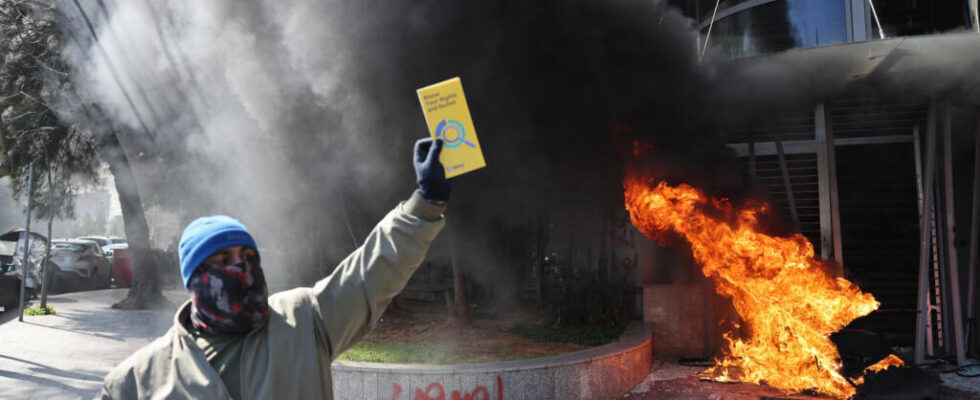 angry protesters vandalize banks