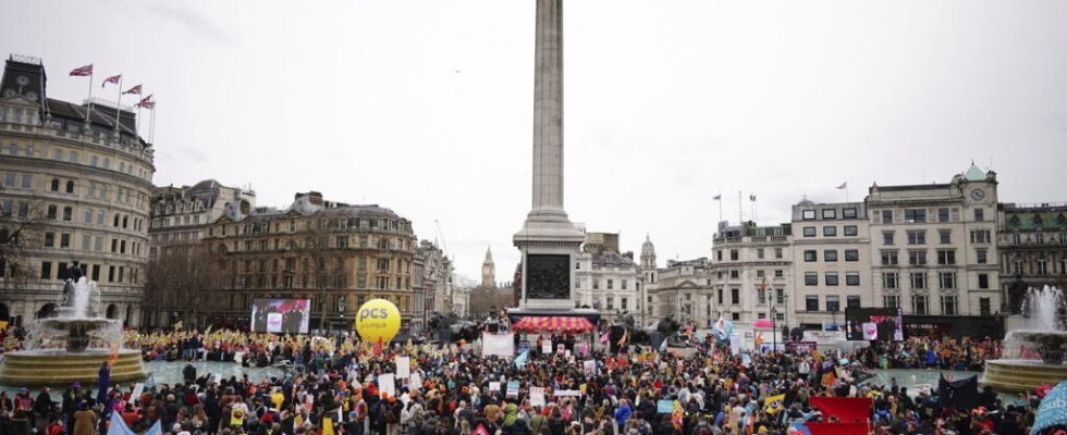 UK unveils less bleak than expected budget during massive strike