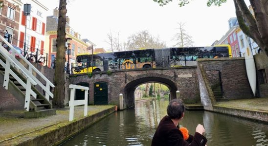 City bus gets lost on Kings Day stuck on bridge