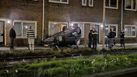 Drunk driver flips over and ends up against a house