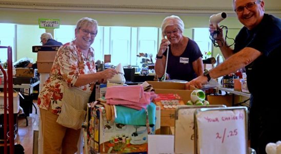 Smiling volunteers prepare for return from St James Variety Sale