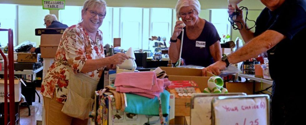 Smiling volunteers prepare for return from St James Variety Sale