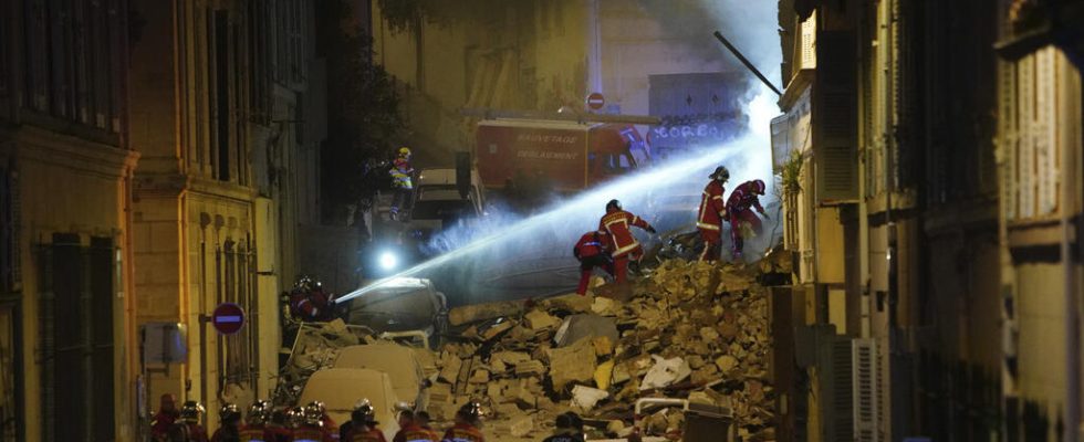 two lifeless bodies extracted from the ruins