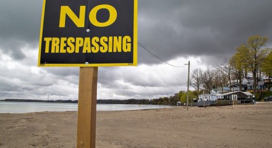 As summer nears popular beach remains blocked amid land battle