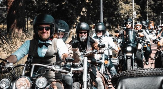 In a suit on the motorcycle for mens health I