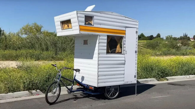 Two friends set up a caravan on a bicycle and