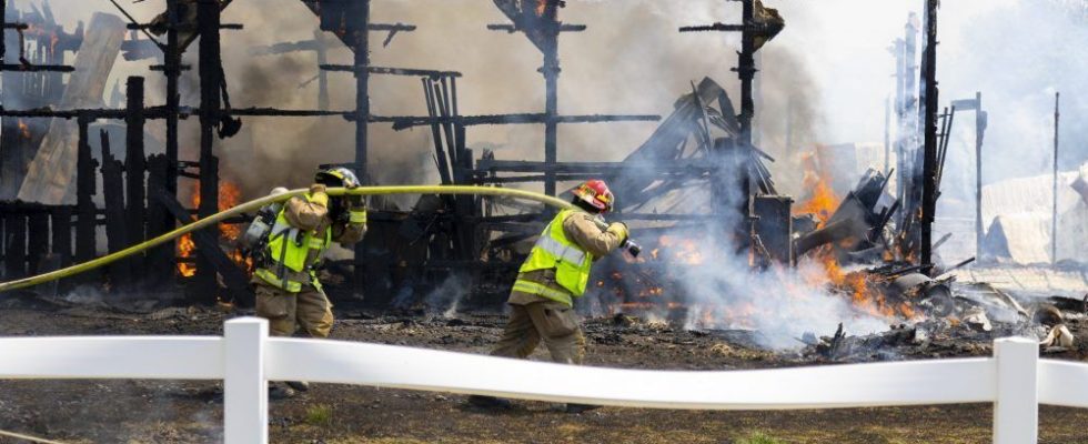 Large blaze tears through London area horse barn