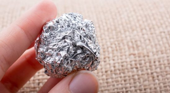 Why You Should Put Aluminum Foil In Your Dishwasher