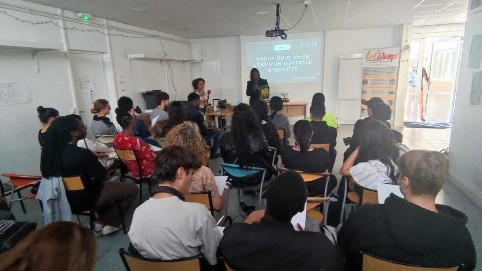 Fanta Kébé, ex-policewoman, leads a workshop on citizens' rights and identity checks.