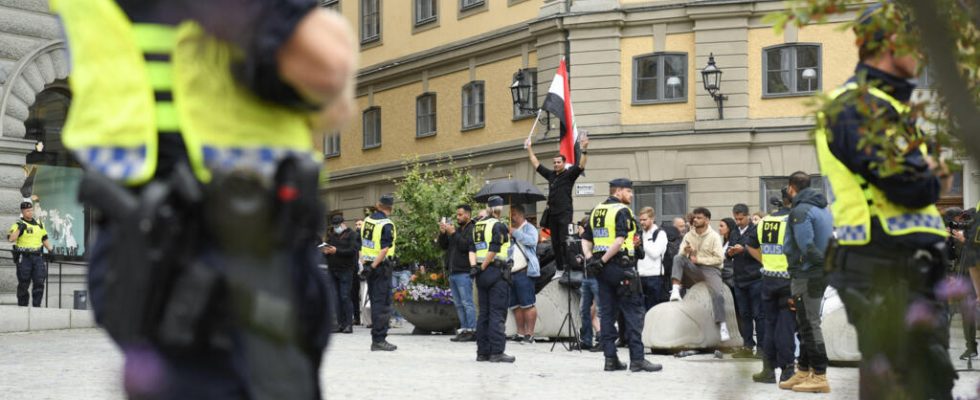 Sweden two men burn a copy of the Koran in