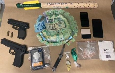 Two people arrested drugs and weapons seized during search