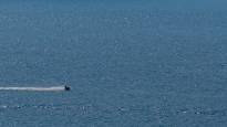 A man riding a jet ski says Algerian border guards