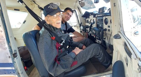 Veteran 99 year old all smiles after flight with fellow pilot