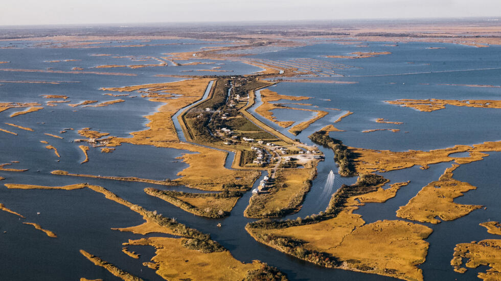 Located in southeastern Louisiana, Isle de Jean-Charles has lost 98% of its surface area since 1955. It is now a thin strip of land surrounded by the waters of the bayou. 