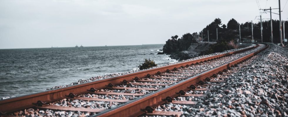 What are the stones placed on the railway tracks used