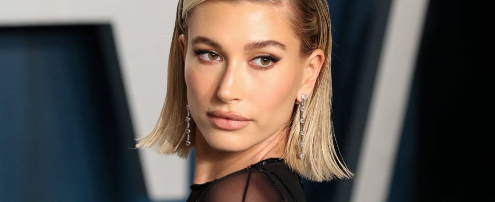 Hailey Bieber transforms denim overalls into chic evening wear