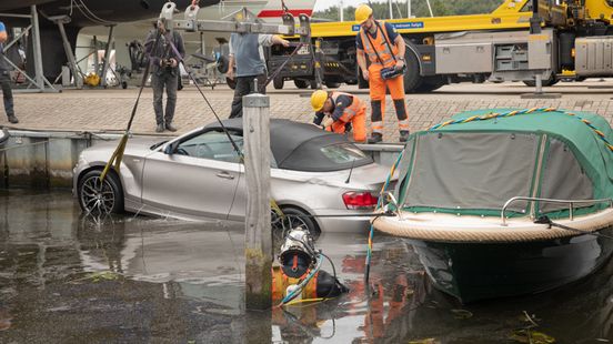 Parked BMW rolls into Baarn marina dog rescued in the