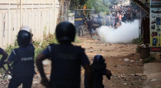 Bangladesh clashes between police and workers during the reopening of