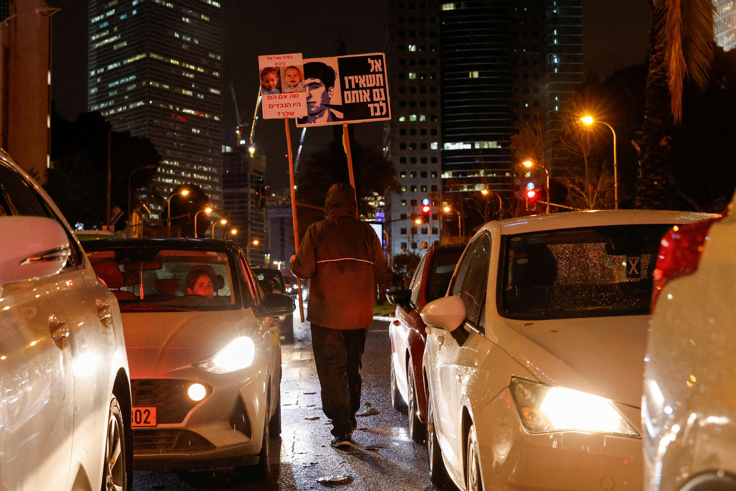 Protesters blocked a key Tel Aviv artery Wednesday evening to urge Benjamin Netanyahu's government to reach a deal for a pause in fighting or a ceasefire.