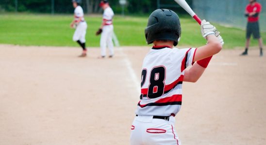 Baseball player Kevin Eaise works with the surgeon who saved