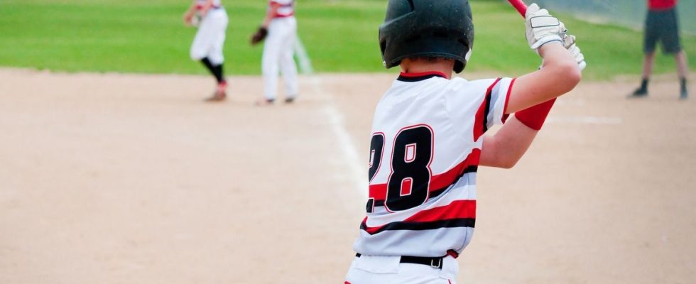 Baseball player Kevin Eaise works with the surgeon who saved