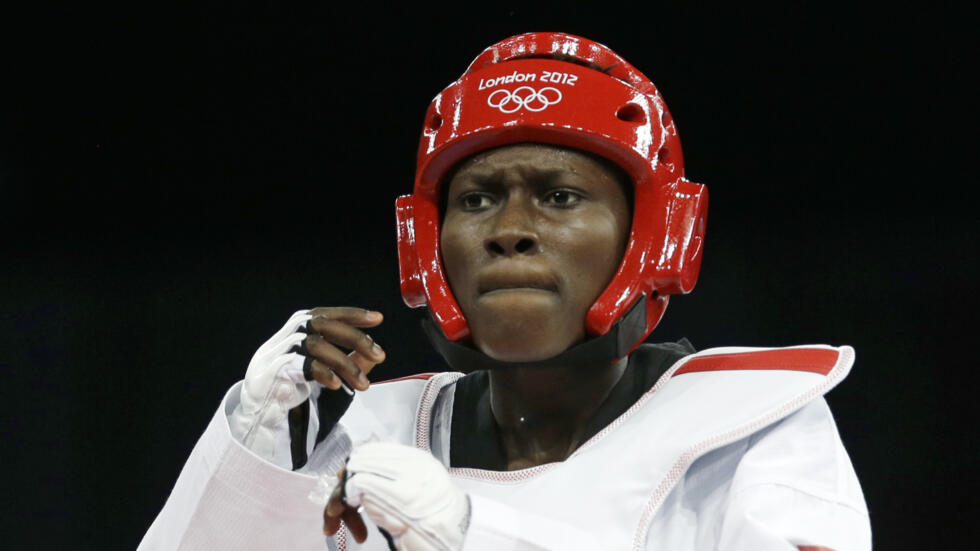 Ruth Gbagbi of Ivory Coast reacts after her fight against South Korea's Hwang Kyung-seon during the women's 67kg taekwondo competition at the 2012 Summer Olympics, Friday, August 10, 2012, in London.