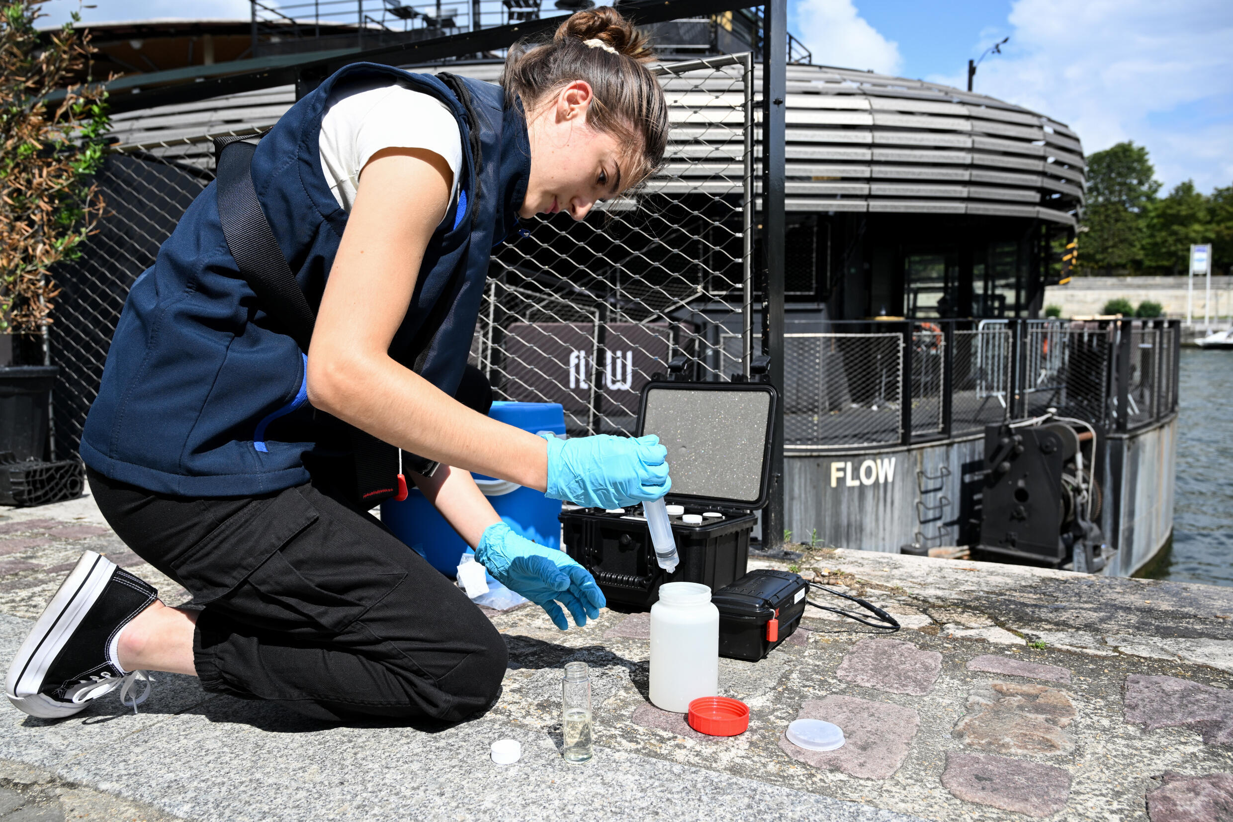 Taking a water sample from the Seine by the company Fluidion, August 4, 2023 in Paris