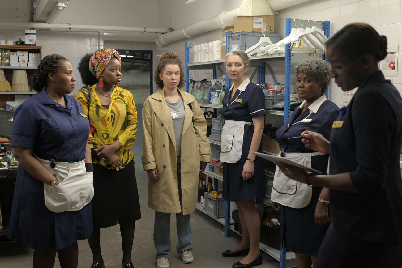 Young Eva, played by Lucie Charles-Alfred (center), arrives at a palace where she is to be trained by Simone, a cantankerous old hand played by Corinne Masiero.