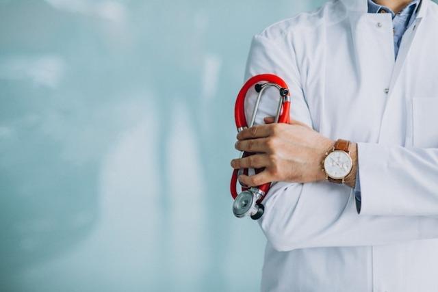 young-handsome-physician-medical-robe-with-stethoscope_1303-17818