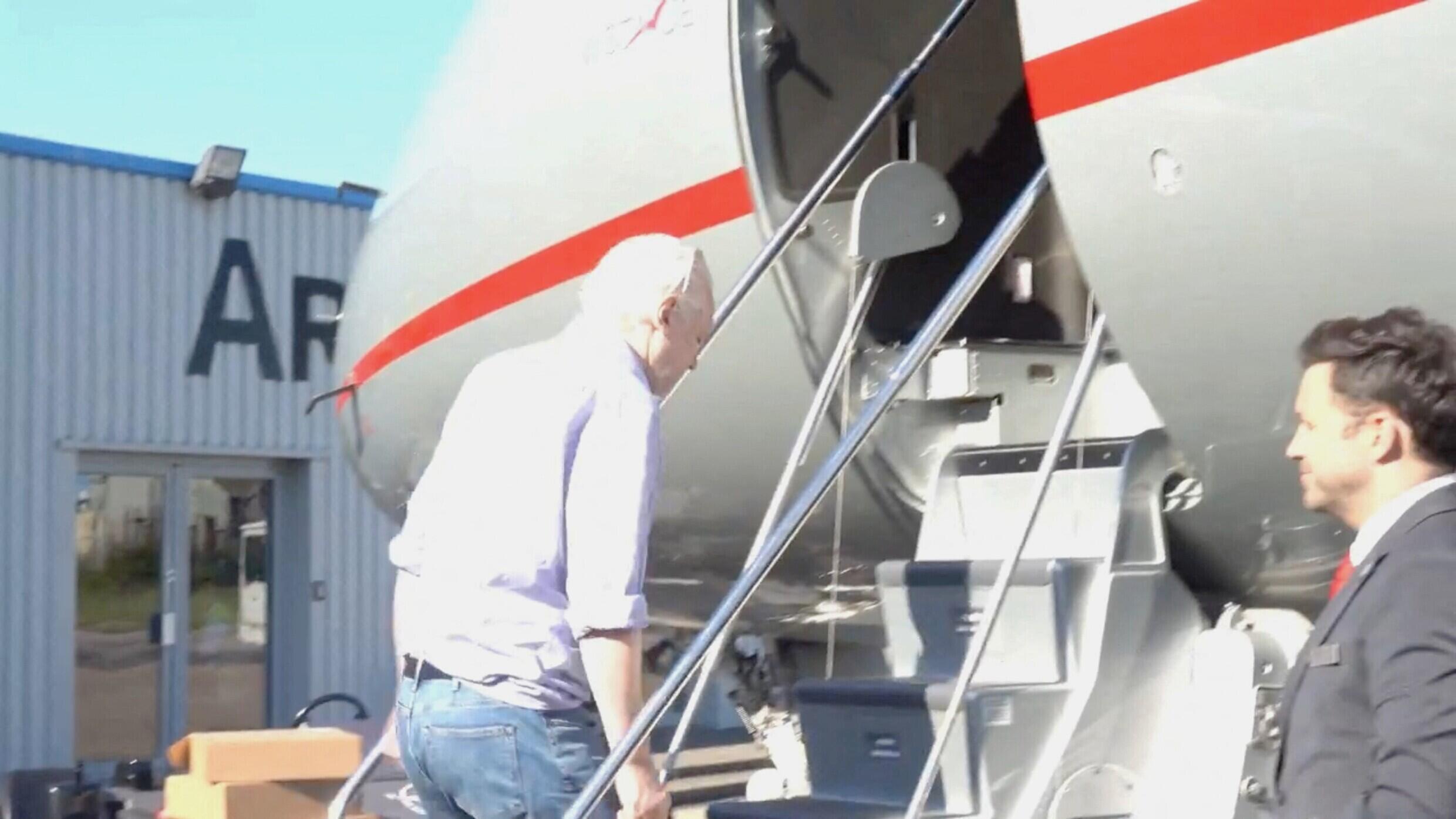 Julian Assange boards a plane at Stansted Airport in London on June 24, 2024.