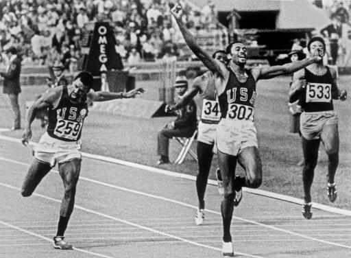 Tommie Smith still with his fist raised