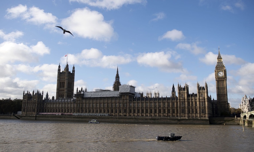 The River Thames flows through central London on November 7, 2016 in front of Parliament. Brussels predicts UK growth to halve in 2017