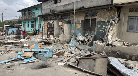 In a partially demolished district of Abidjan everything is buried