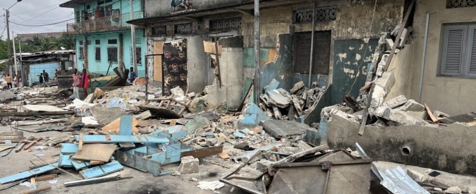 In a partially demolished district of Abidjan everything is buried