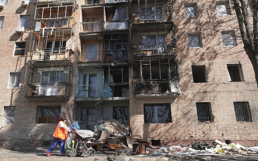 A resident walks past a building hit by Ukrainian strikes in Kursk, Russia, on August 16, 2024.