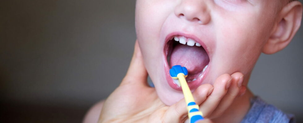 A dentists foolproof tips to get baby to accept brushing