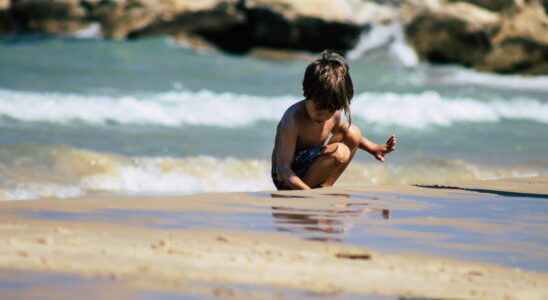 This activity of many children on the beach is more